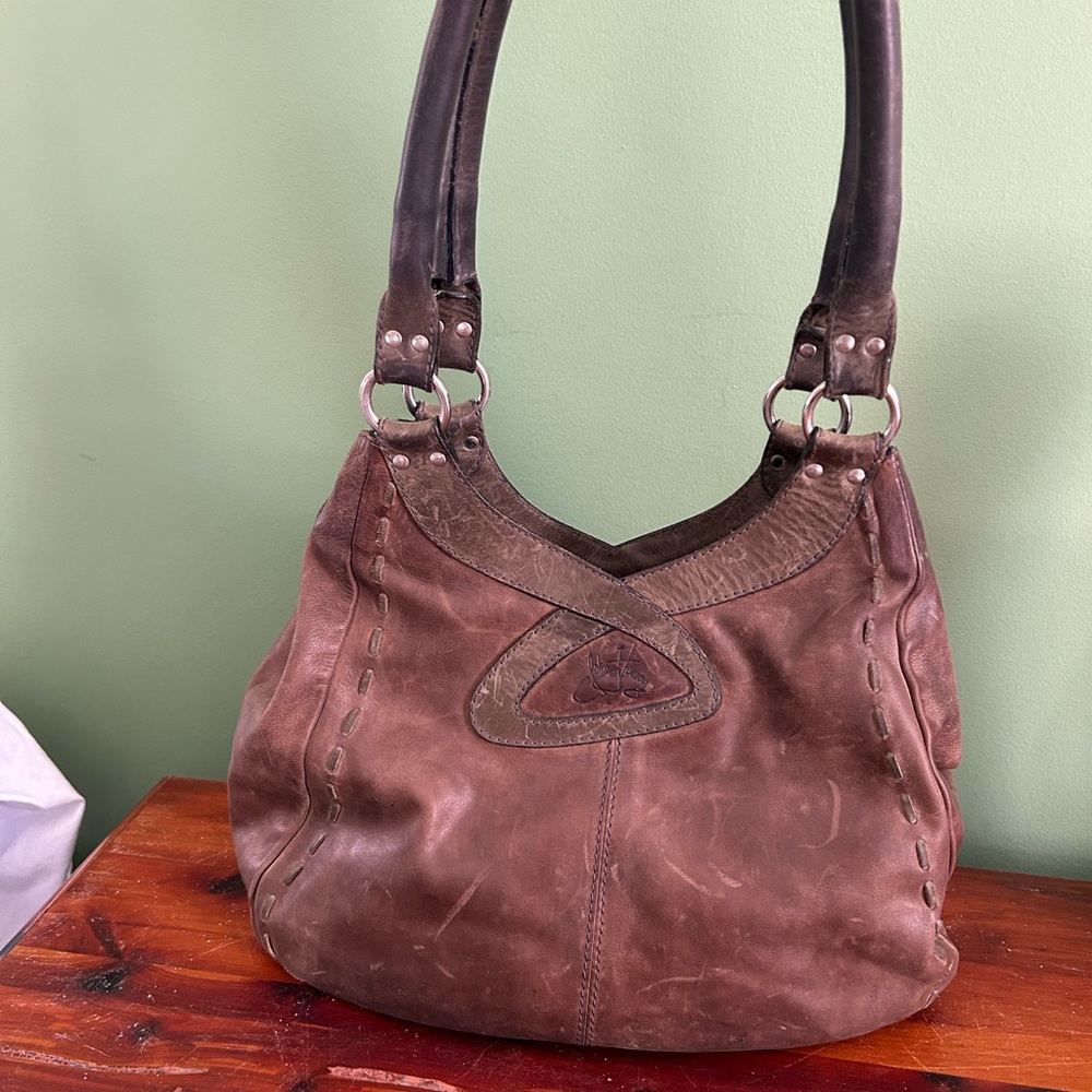 Vintage John Fluevog purse. Medium size. Brown with turquoise lining.